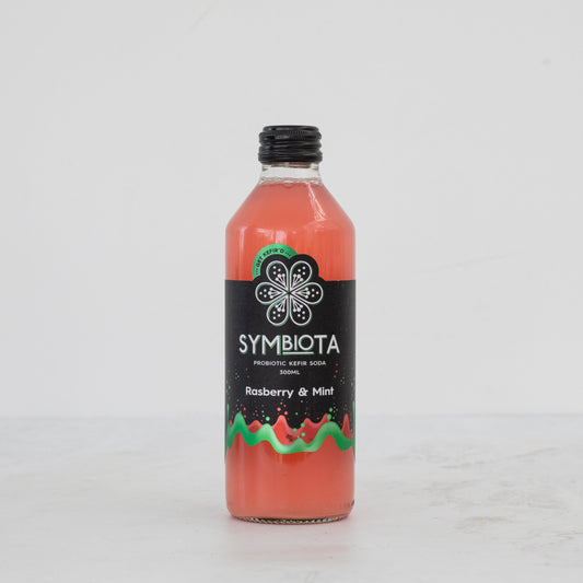 bottle of raspberry mint kefir soda by symbiota