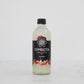 bottle of lychee probiotic kefir soda by symbiota