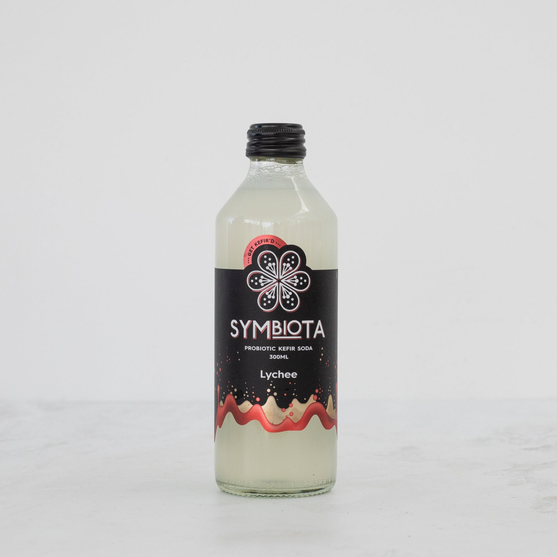 bottle of lychee probiotic kefir soda by symbiota