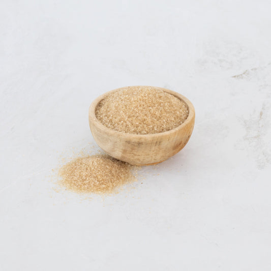 Organic Brown sugar in a bowl by Symbiota